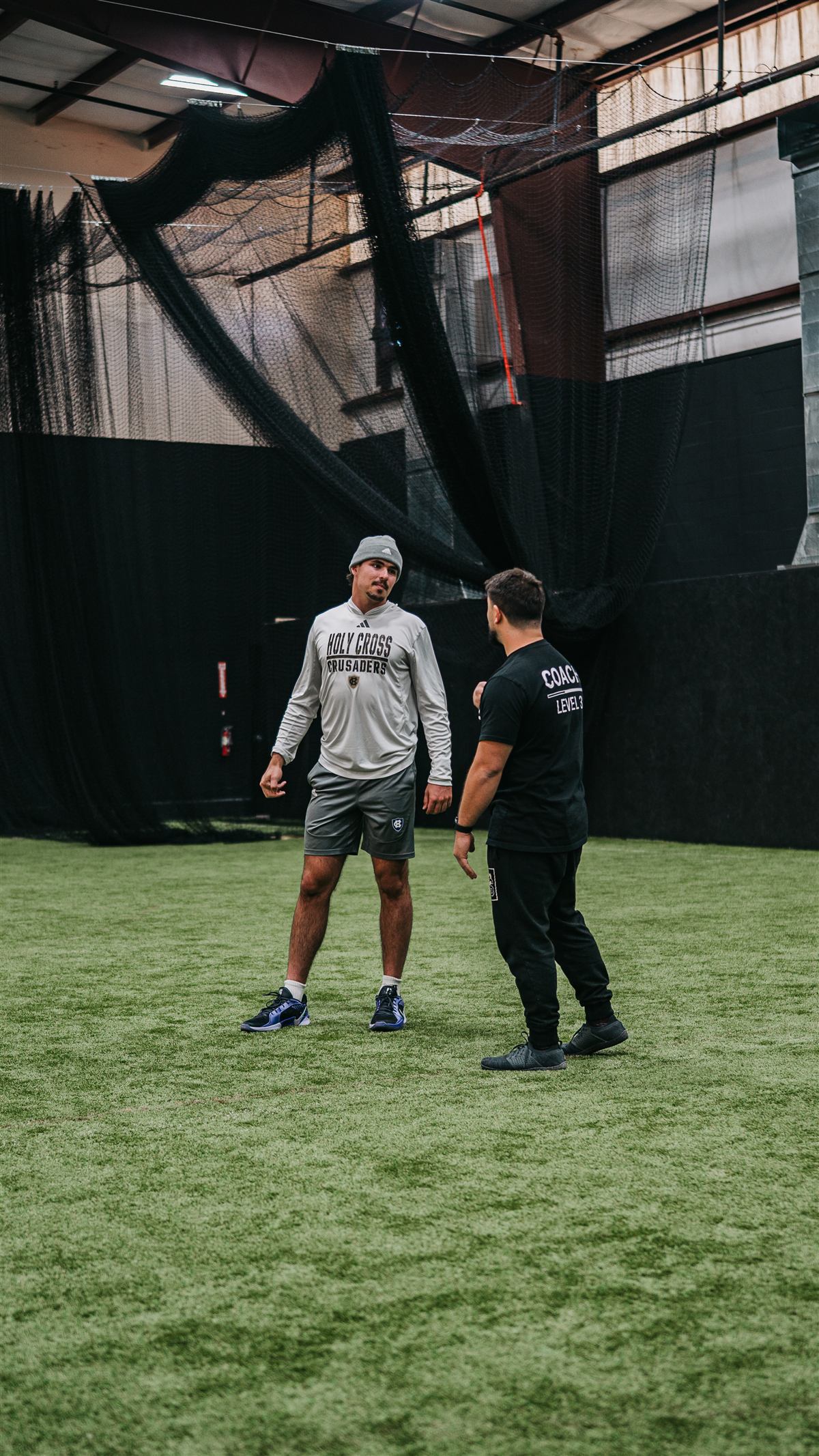 Ellis Wells working one-on-one with a client on indoor turf