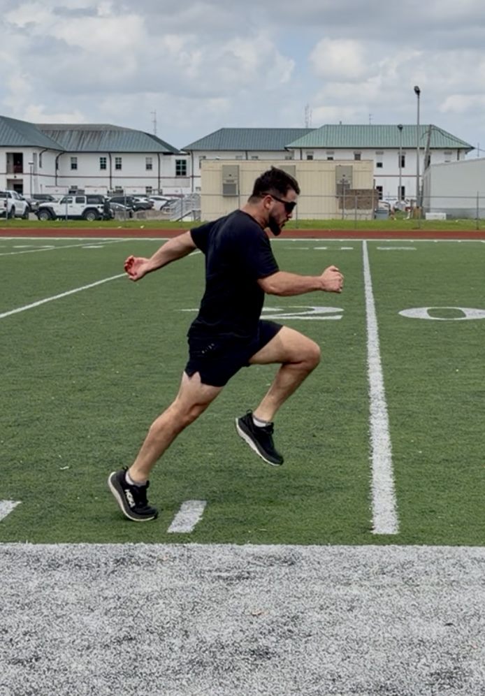 Ellis Wells mid-sprint in an acceleration drill on a football field